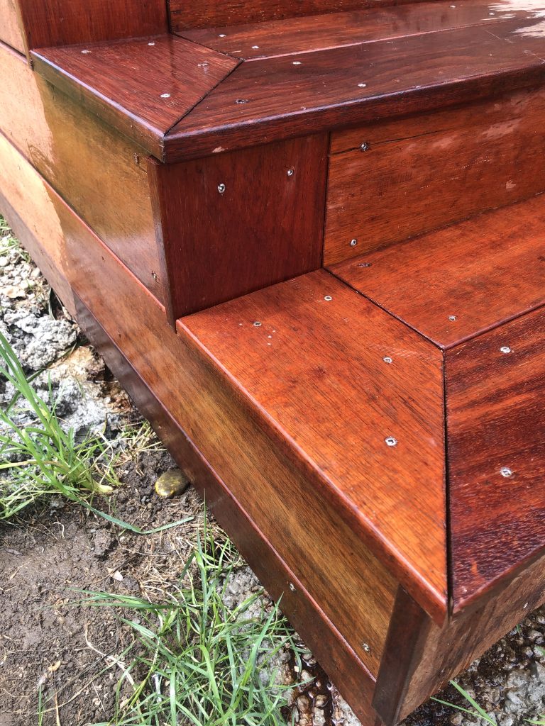 Close up of freshly stained wooden stairs on a newly built deck