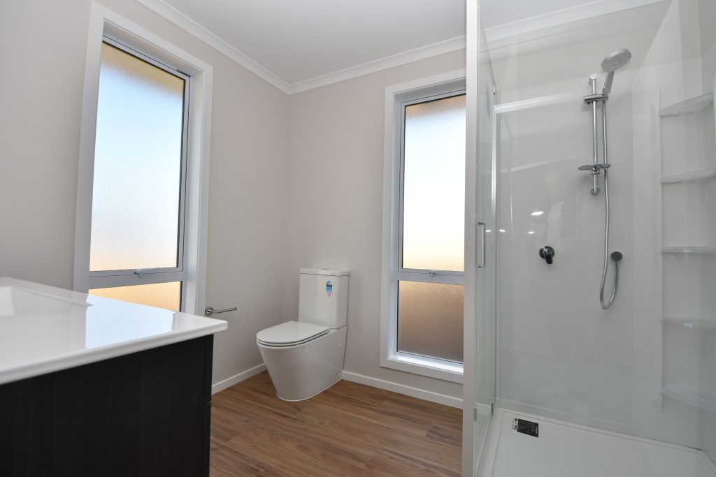 A freshly built ensuite bathroom in a new home